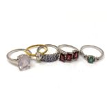 Five silver gem set dress rings.