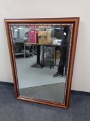 A contemporary bevelled overmantel mirror