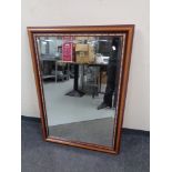 A contemporary bevelled overmantel mirror