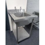A stainless steel commercial two tier sink unit, width 60 cm.