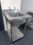 A stainless steel commercial two tier sink unit, width 60 cm.