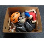 A box containing soft toys, safety helmets, resistance bands.
