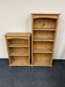 Two sets of pine open bookshelves.