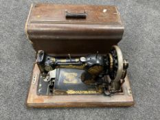 A vintage Jones cased sewing machine.