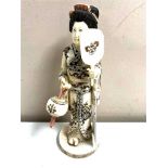 A Japanese carved bone and penwork okimono, Geisha, height 21.