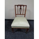 An Edwardian mahogany bedroom chair