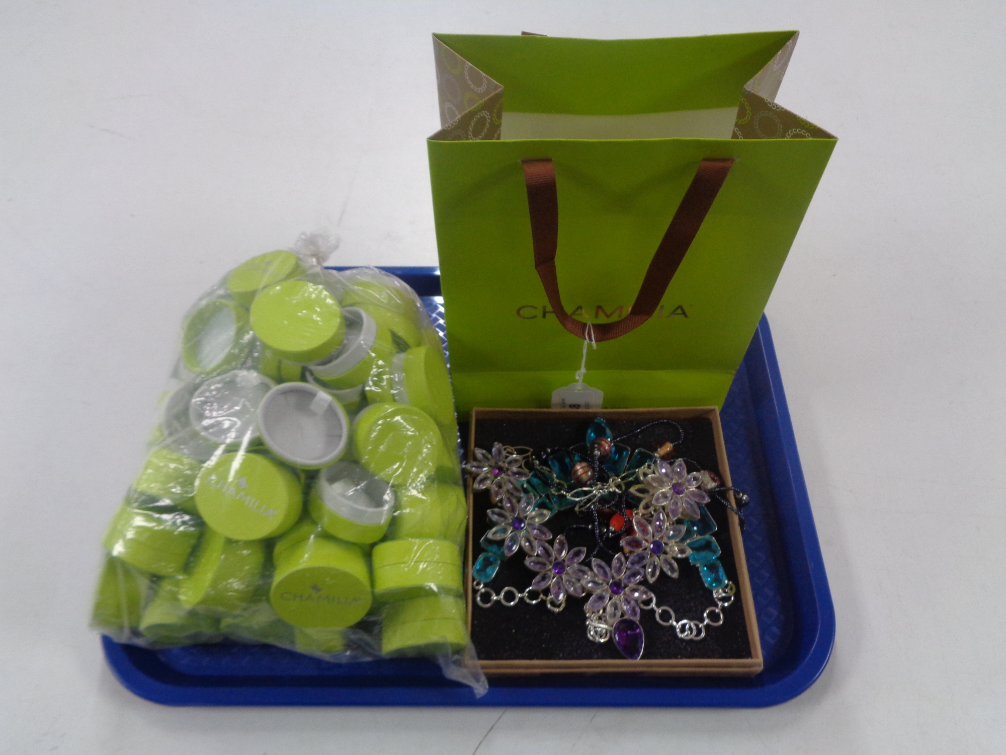 A quantity of Chamilia ring boxes, heavy white metal necklaces and gift bag.