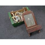 An Edwardian wall mirror with glove box together with a box containing continental figures.