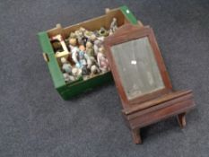 An Edwardian wall mirror with glove box together with a box containing continental figures.