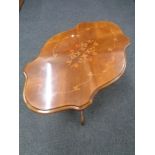 A shaped Italianate pedestal coffee table