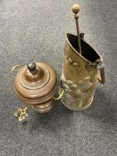 An antique copper and brass tea urn together with a brass embossed coal receiver with fire poker.