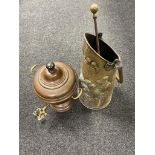 An antique copper and brass tea urn together with a brass embossed coal receiver with fire poker.