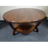 A contemporary circular two tier coffee table