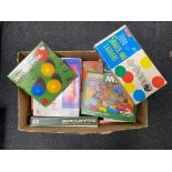 A box containing vintage board games by Merit, Waddingtons etc.