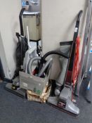 Two vintage Kirby vacuums together with a large quantity of accessories.