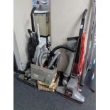 Two vintage Kirby vacuums together with a large quantity of accessories.