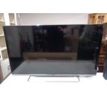 A Panasonic TX-40CS260B LCD TV on stand with lead and remote.