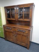 A 20th century oak double door sideboard fitted two drawers with cupboards above