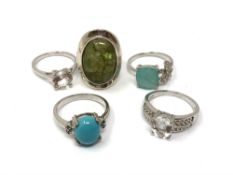 Five silver gem set dress rings.