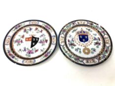 A pair of 19th century armorial cabinet plates, width 24 cm.