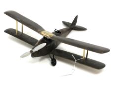 A uniquely constructed brass bi-plane, length 36 cm.