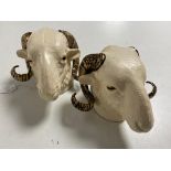 Two cast iron ram's heads