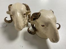 Two cast iron ram's heads