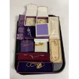 A tray containing boxed silver and costume jewellery to include necklaces, earrings etc.