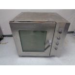 A Smeg stainless steel commercial oven, width 87 cm.