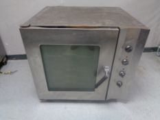 A Smeg stainless steel commercial oven, width 87 cm.