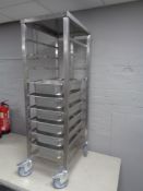 A stainless steel commercial Bain Marie trolley with Bain Marie trays, height 137 cm.