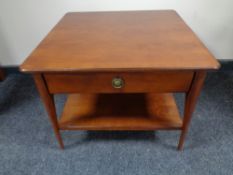 A contemporary square two tier coffee table fitted a drawer