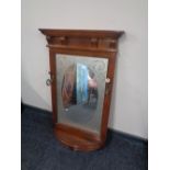 An Edwardian frosted glass framed hall mirror with shelf and coat hooks