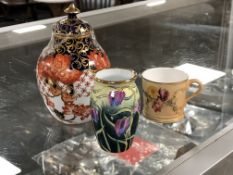 A miniature Royal Worcester hand painted blush ivory mug together with a miniature Moorcroft vase