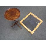 A tabletop display case together with a mahogany wine table.