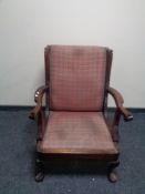 An Edwardian wingback armchair