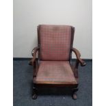 An Edwardian wingback armchair