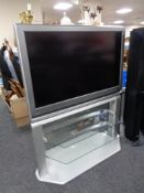 A Toshiba 37'' LCD TV with remote, on stand.