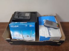 A box containing electronic safe, a TP-link router with a Verifone VX680 PDQ machine.