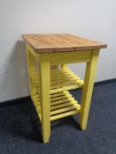 A pine butcher's block trolley on painted base