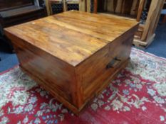 A sheesham wood storage coffee table