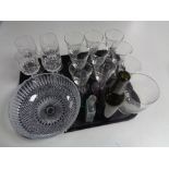 A tray of assorted glass ware to include antique glass bottles, bud vases, wine glasses,
