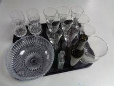 A tray of assorted glass ware to include antique glass bottles, bud vases, wine glasses,