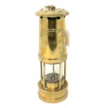A brass miner's lamp by E Thomas & Williams Ltd