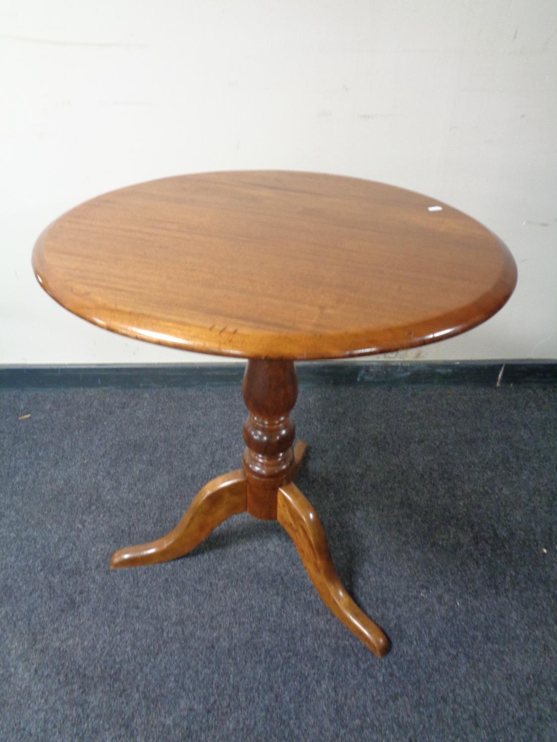 A 19th century mahogany tilt top pedestal occasional table