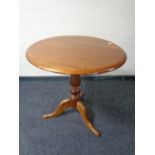 A 19th century mahogany tilt top pedestal occasional table