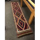 A Suzni kilim runner 313 x 68 cm.