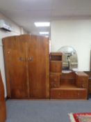 A 1930s walnut four piece bedroom suite comprising of double door wardrobe,
