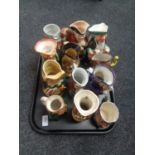 A tray containing assortment of Toby jugs.