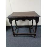 A nineteenth century carved oak occasional table